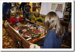 2 girls playing Joust Pinball